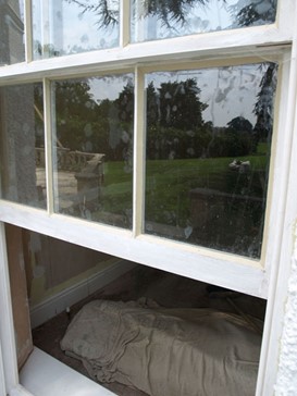 White wooden sash window opening