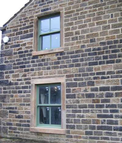 Green painted wooden sash windows