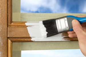 Painting a window frame with white color