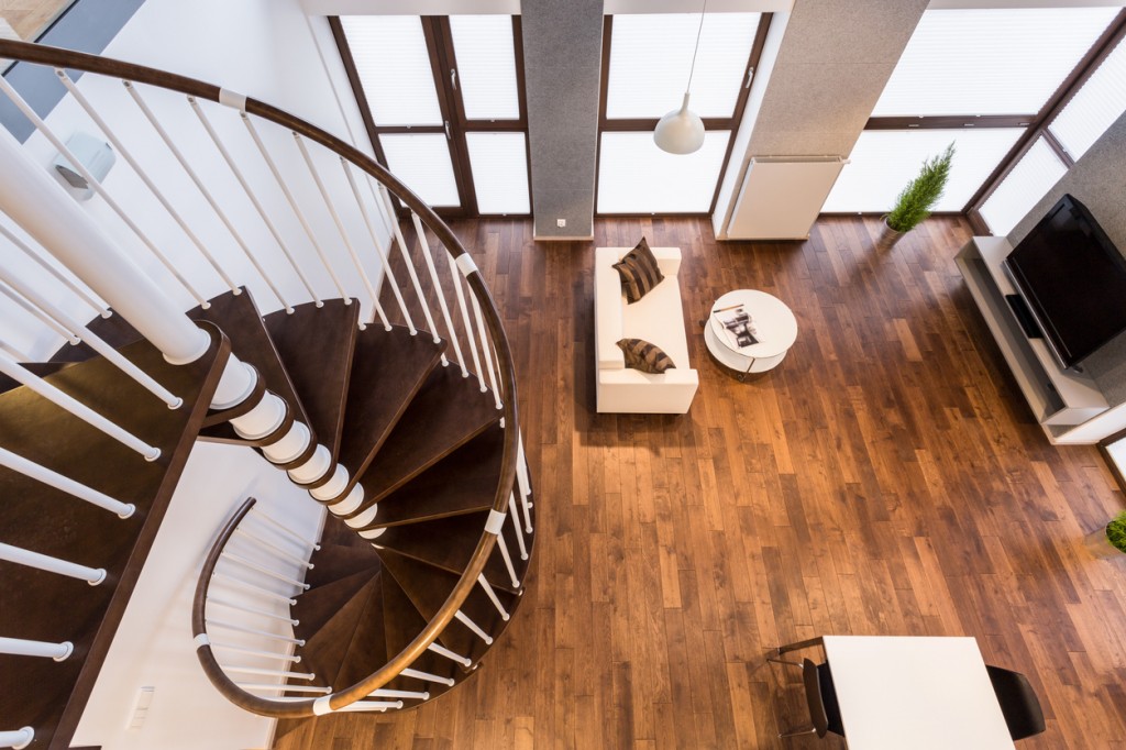 Curve wooden stairs in spacious living room