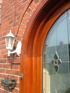 Details on a handcrafted wooden front door