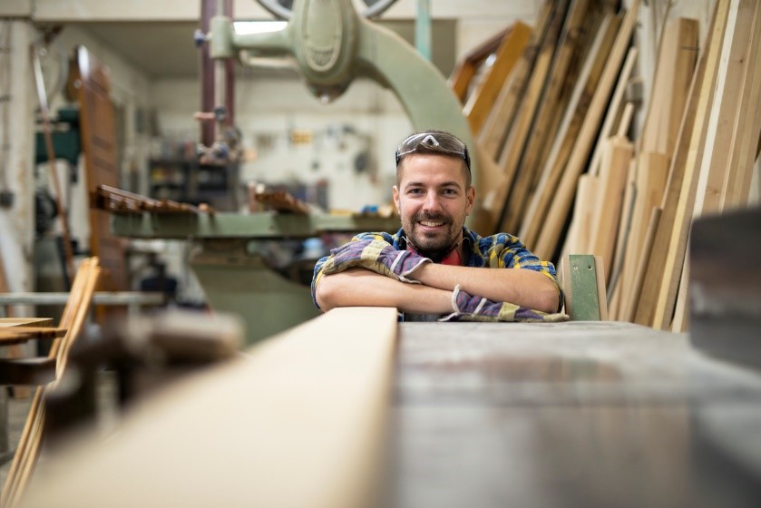 Joiner in a workshop wearing protective gear