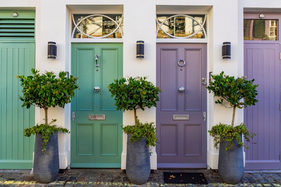 Teal and purple wooden doors next to each other