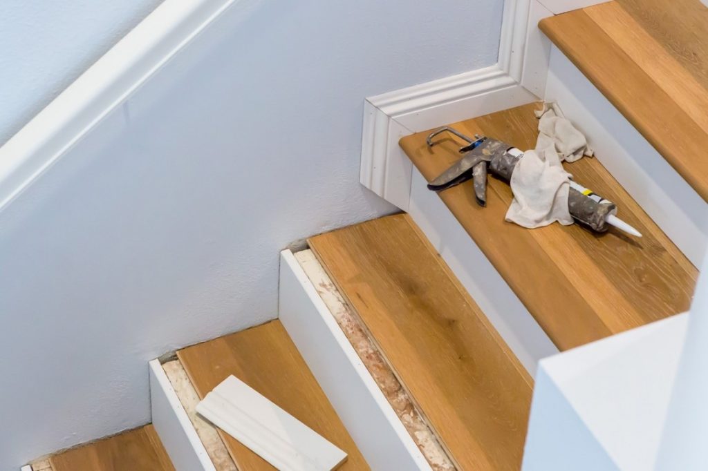 Tools on a partly renovated wooden staircase