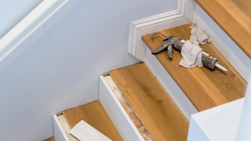 Tools on a partly renovated wooden staircase