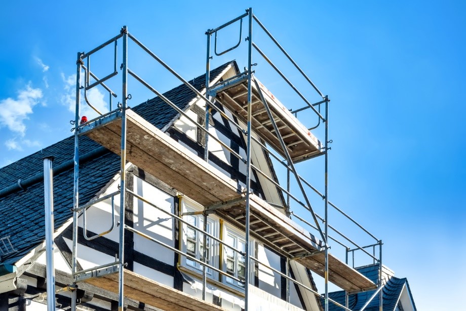 Scaffoldings in front of the windows that are being restored