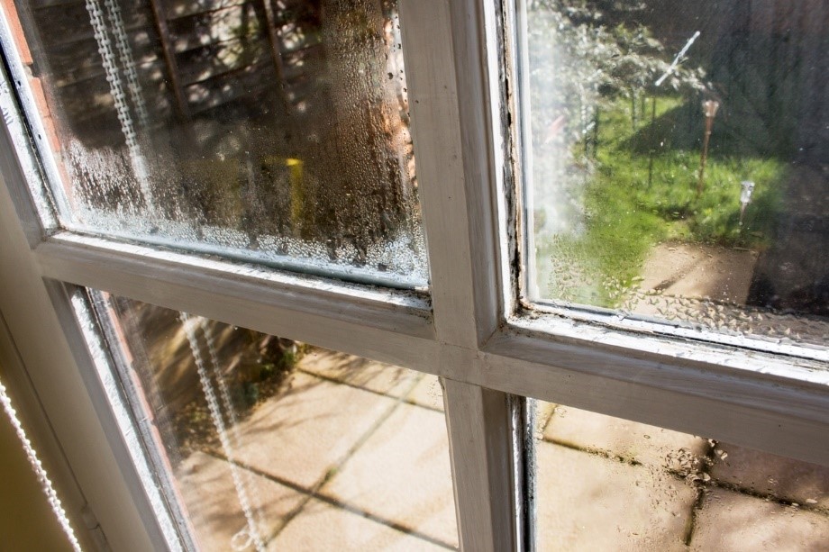 A window that is covered in condensation. 