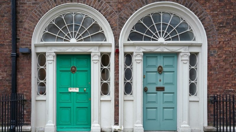 two gorgeous front doors, one green and one blue