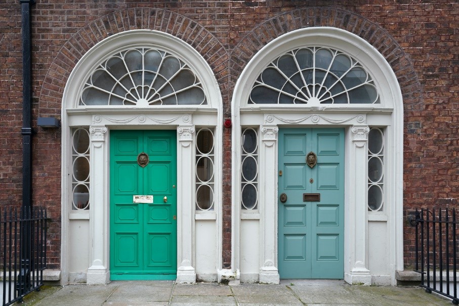 two gorgeous front doors, one green and one blue