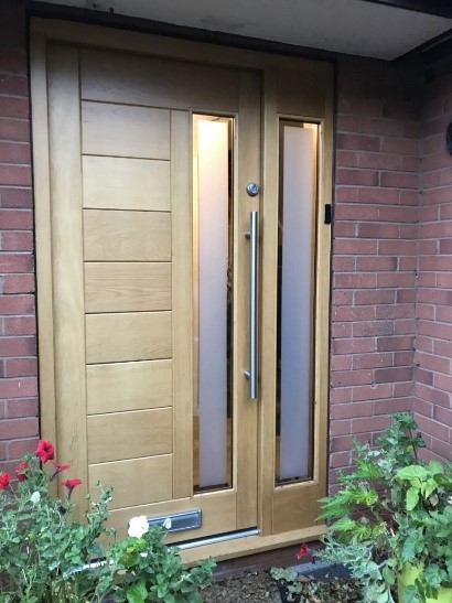 wooden front door with tongue and groove panelling